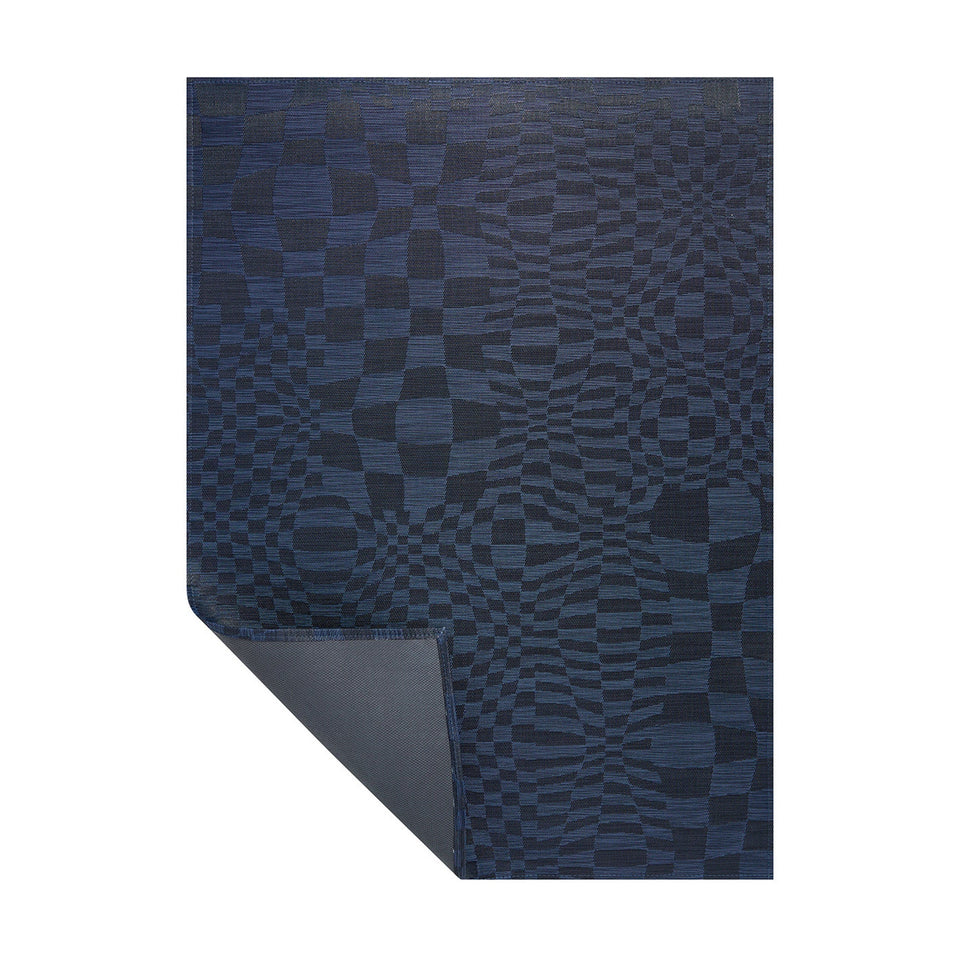 Ocean Warp woven floor mat by Chilewich, folded-corner view