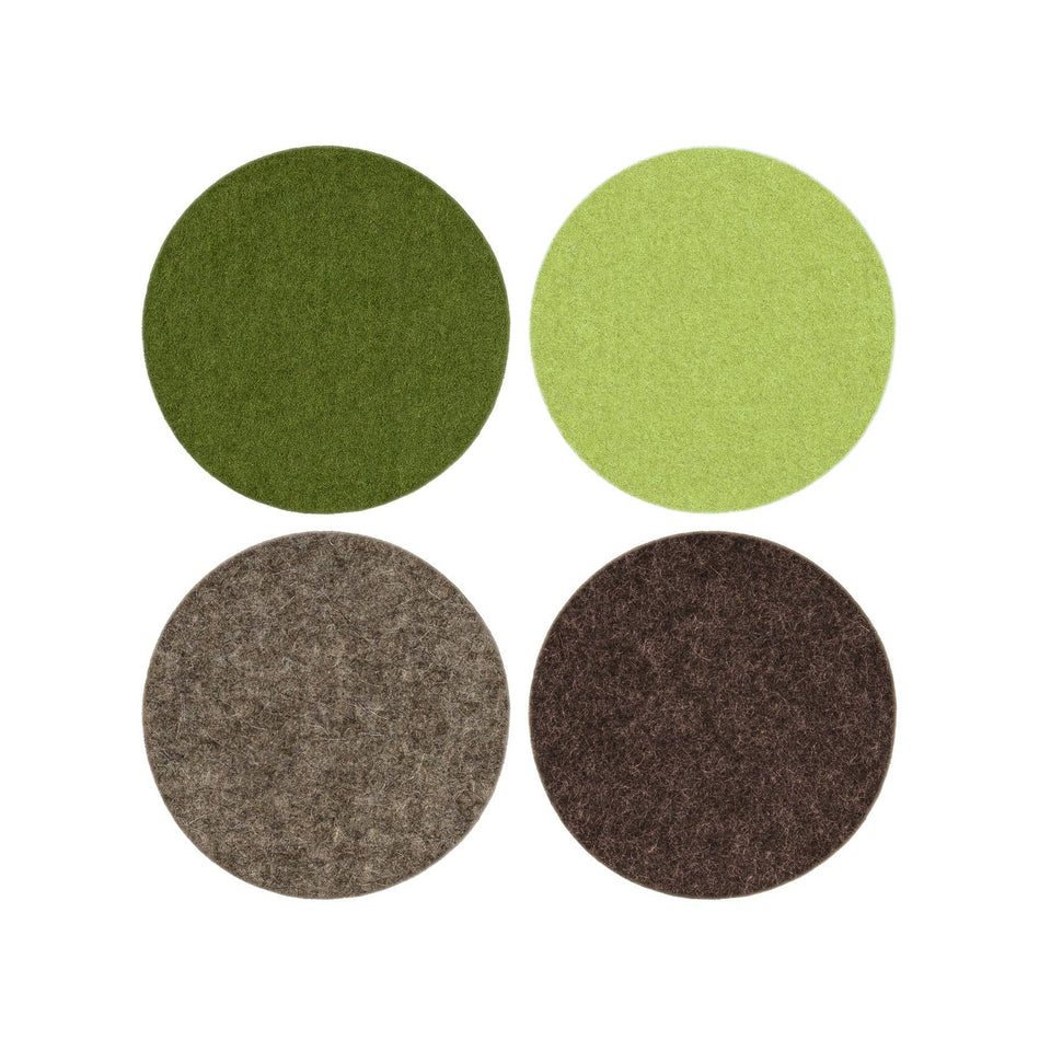 Four circular coasters in green, brown, and gray on a white background