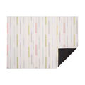 Almond Appliqué woven floor mat by Chilewich, horizontal folded-corner view