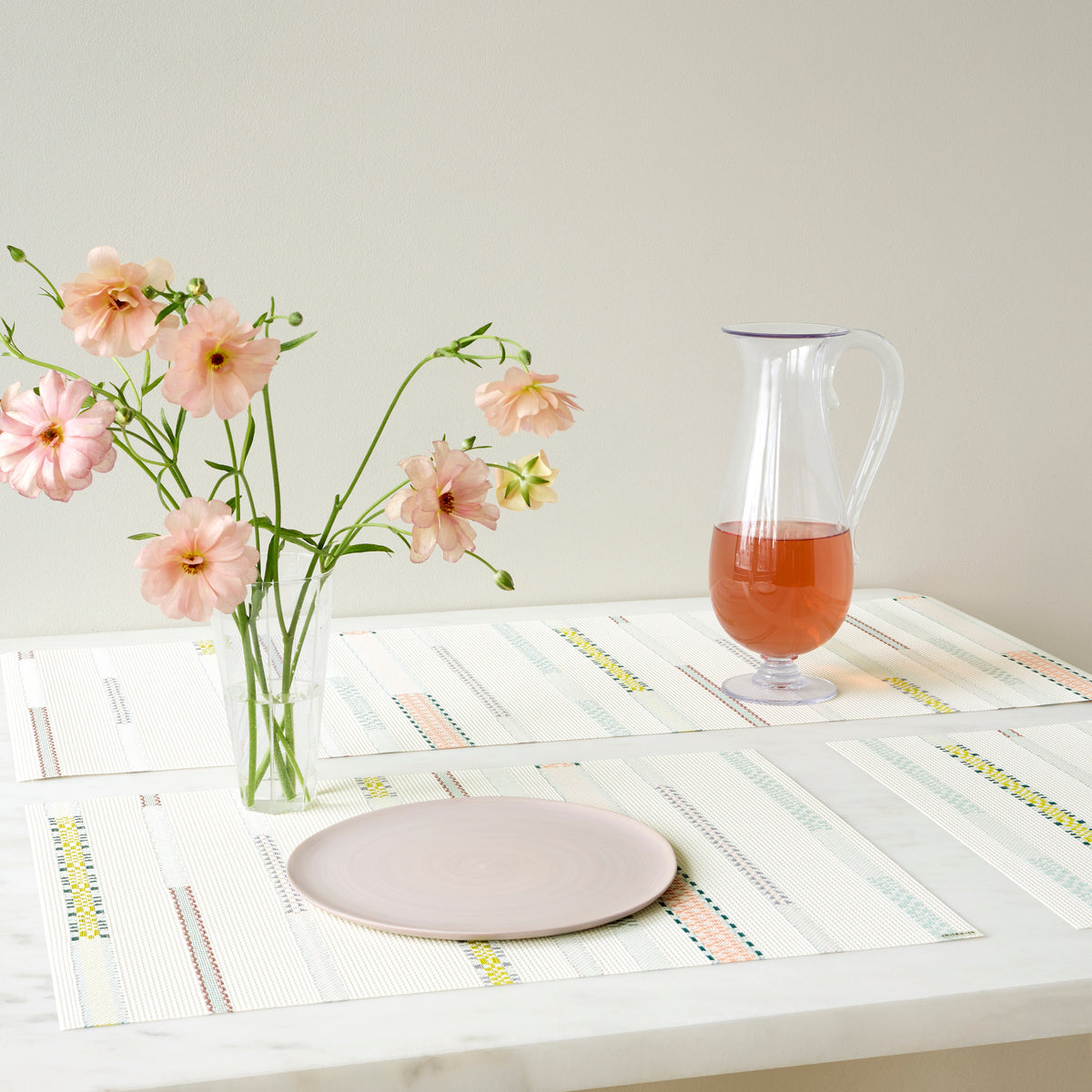 Chilewich Appliqué in Almond, shown in a styled table setting