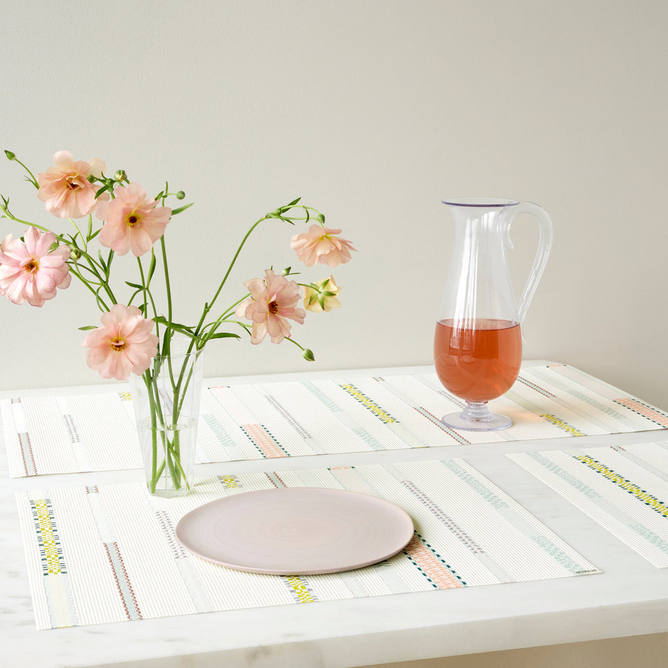 Chilewich Appliqué in Almond, shown in a styled table setting