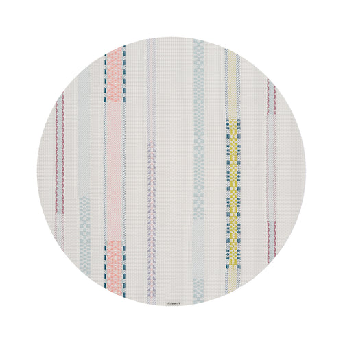 Chilewich Appliqué round placemat in Almond, viewed from above on a white background