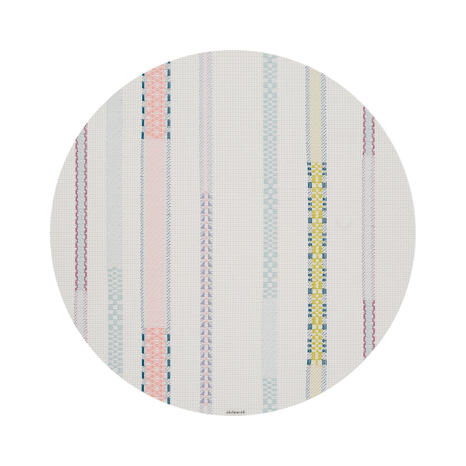 Chilewich Appliqué round placemat in Almond, viewed from above on a white background
