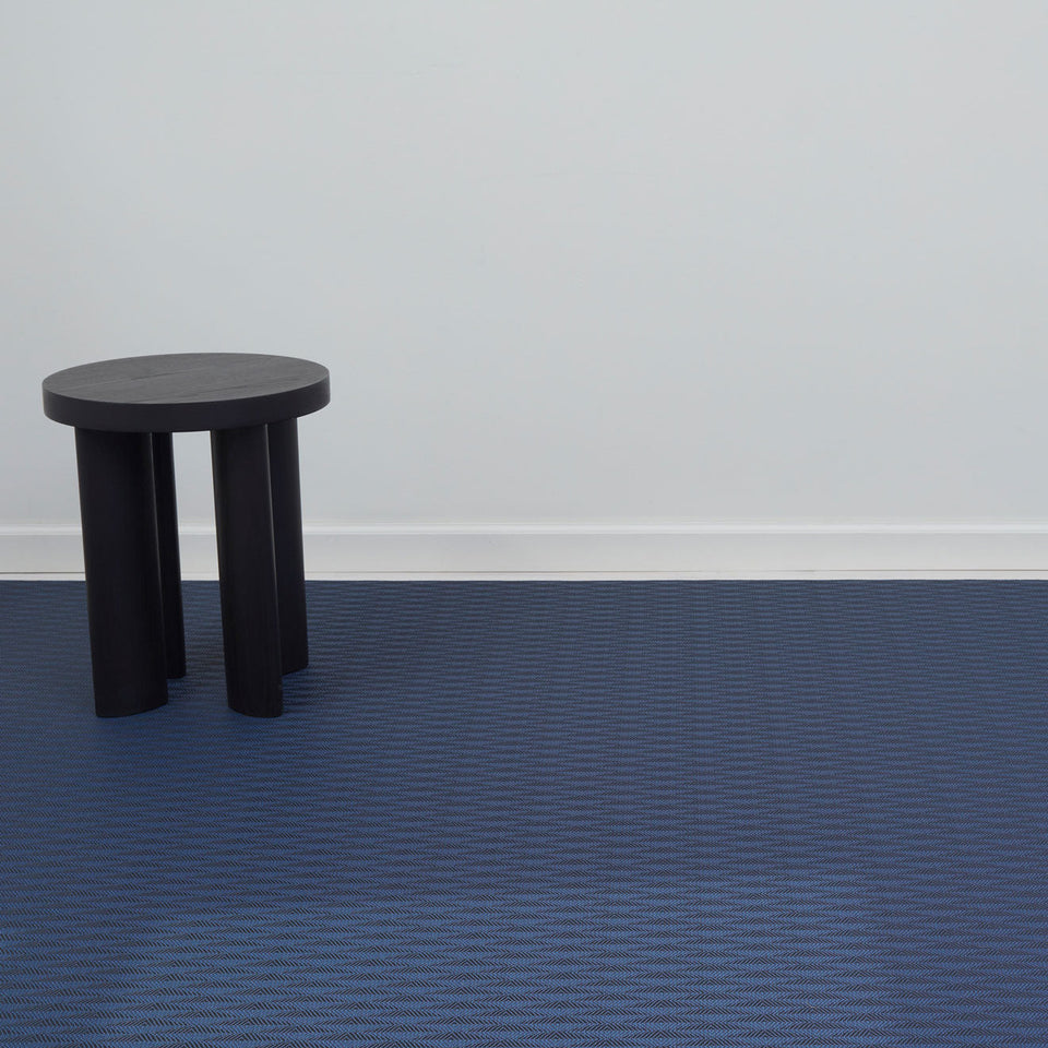 Arrow / Sapphire woven floor mat by Chilewich, interior setting