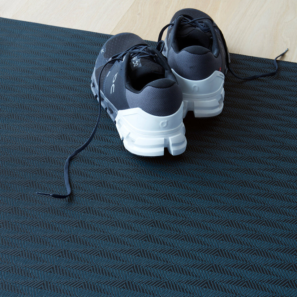 Arrow / Sapphire woven floor mat by Chilewich, interior setting