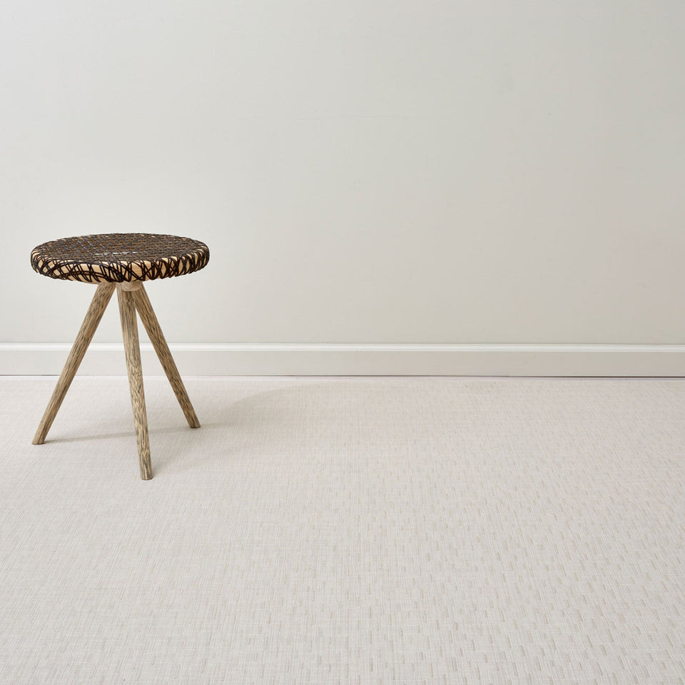 Bamboo / Chino woven floor mat by Chilewich, interior setting