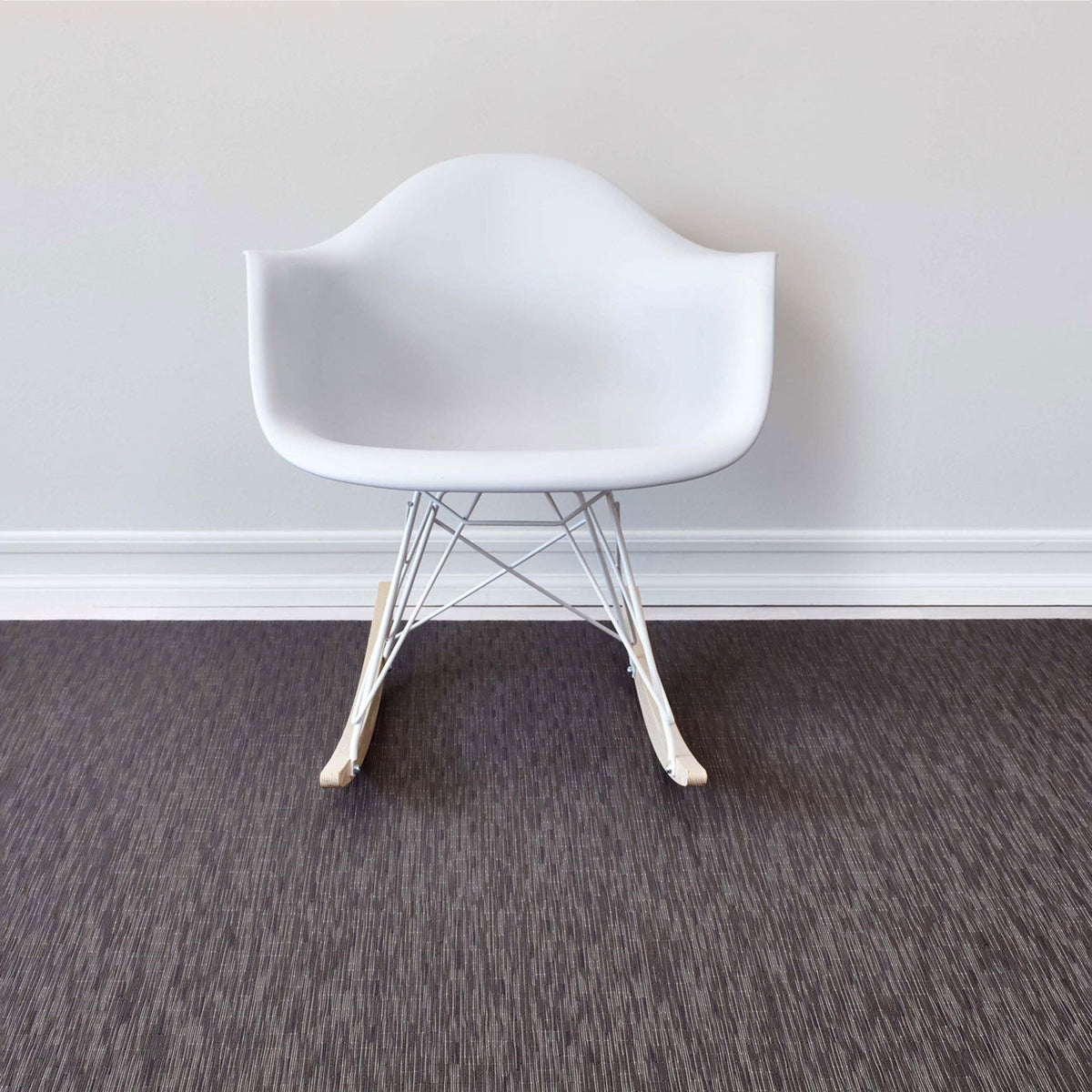 Bamboo / Grey Flannel woven floor mat by Chilewich, interior setting