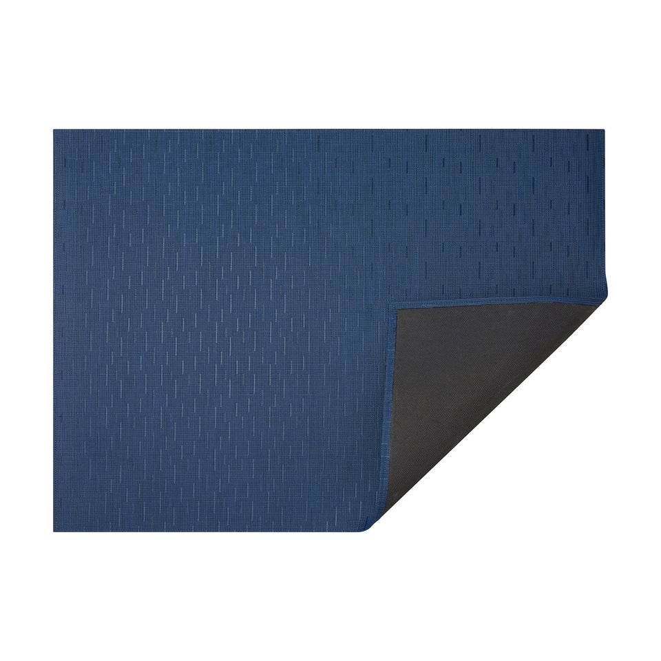 Lapis Bamboo woven floor mat by Chilewich, horizontal folded-corner view