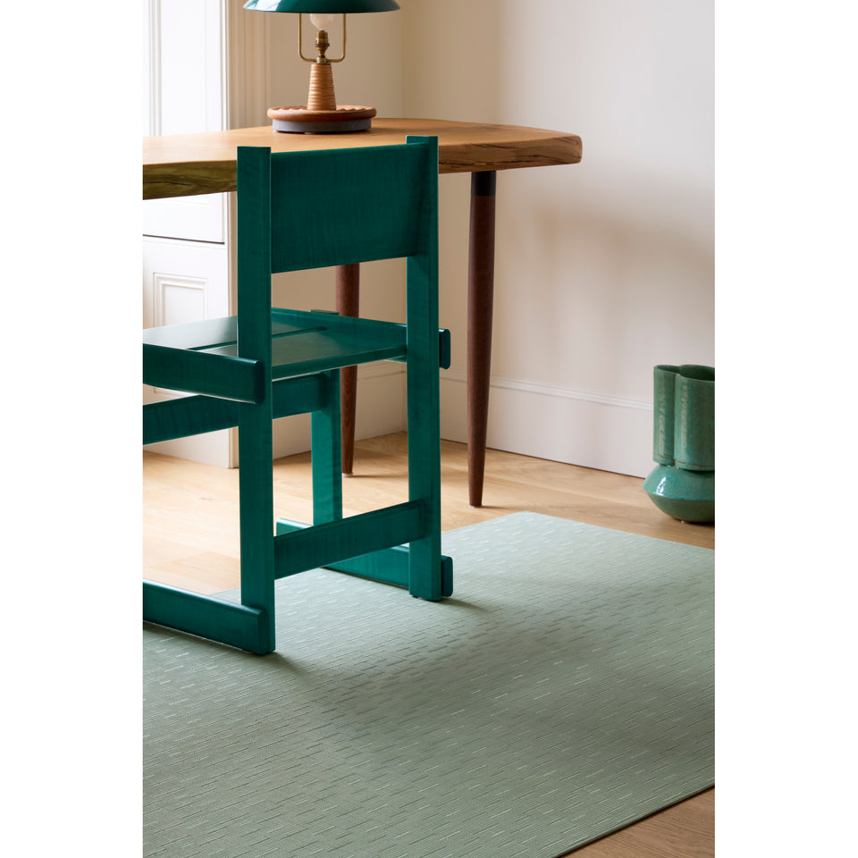 Bamboo / Seaglass woven floor mat by Chilewich, interior setting