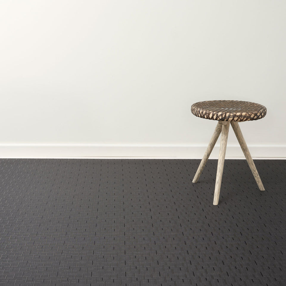 Bamboo / Smoke woven floor mat by Chilewich, interior setting