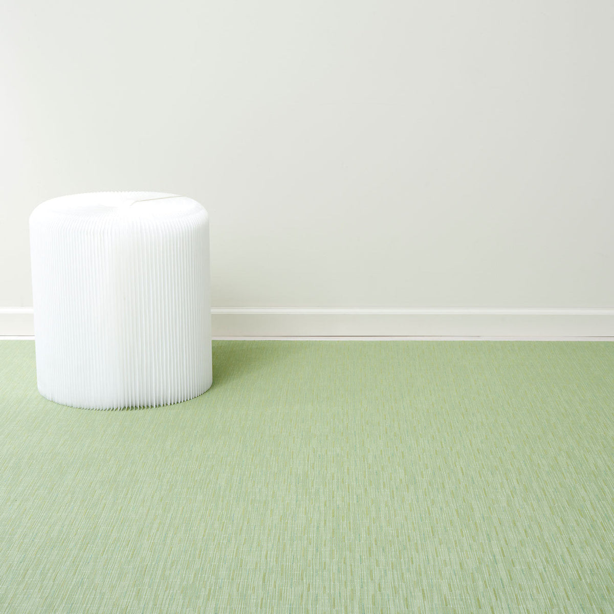 Bamboo / Spring Green woven floor mat by Chilewich, interior setting