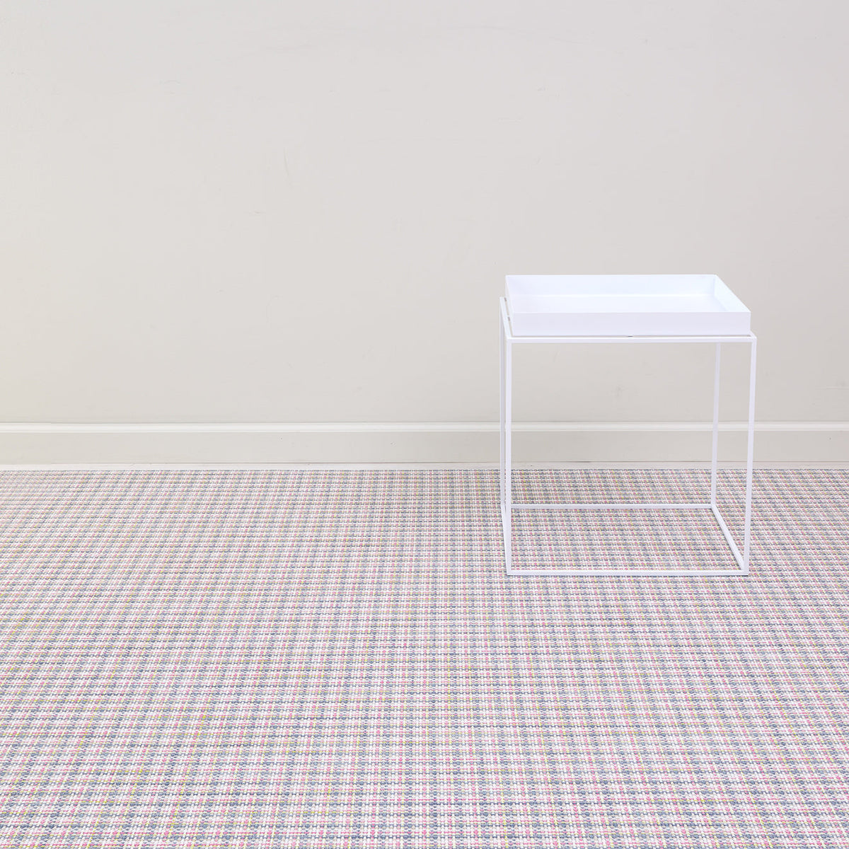 Basketweave / Begonia woven floor mat by Chilewich, interior setting