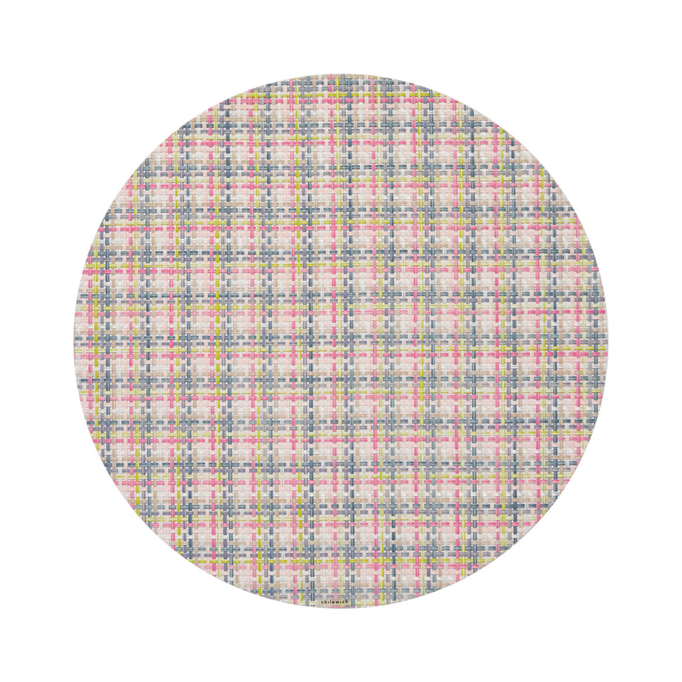 Chilewich Basketweave round placemat in Begonia, viewed from above on a white background