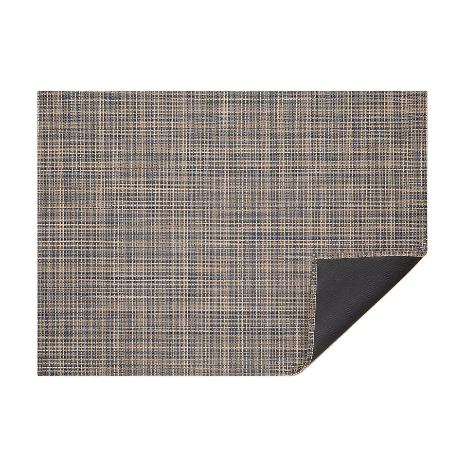 Coast Basketweave woven floor mat by Chilewich, horizontal folded-corner view
