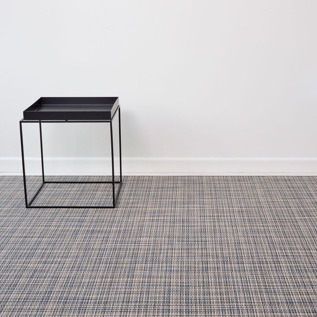 Basketweave / Coast woven floor mat by Chilewich, interior setting