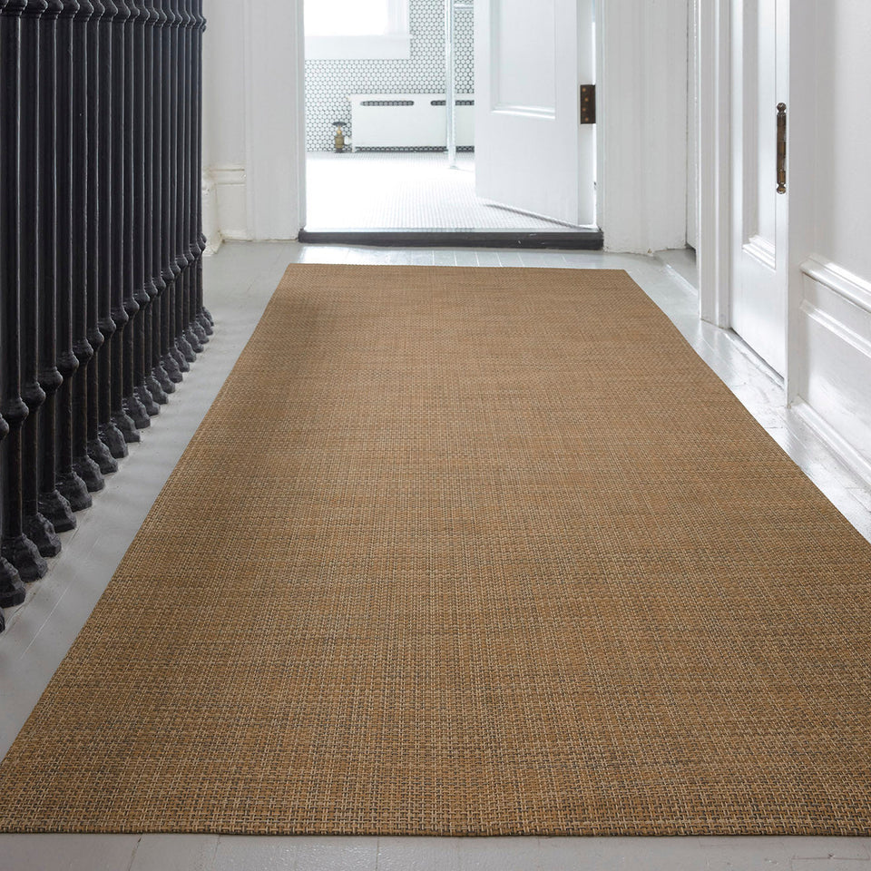 Basketweave / Teak woven floor mat by Chilewich, interior setting
