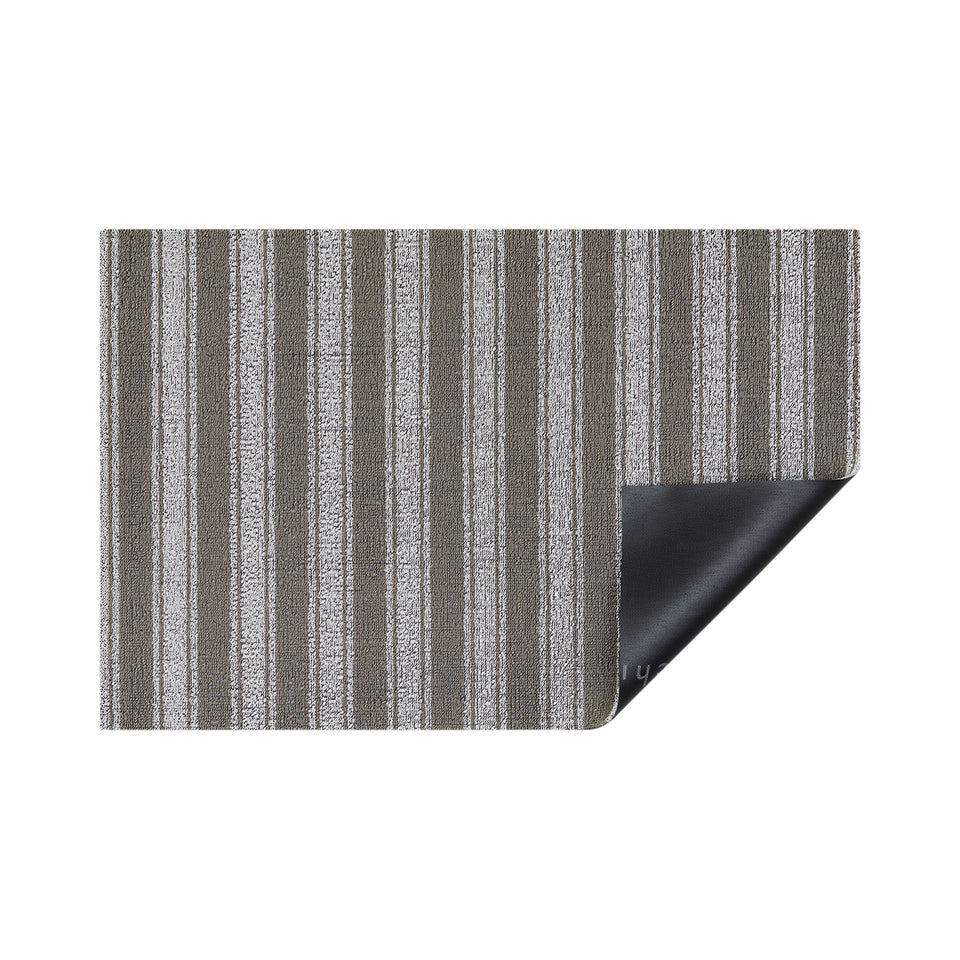 Walnut Boardwalk Stripe Shag Mat by Chilewich — folded corner showing backing