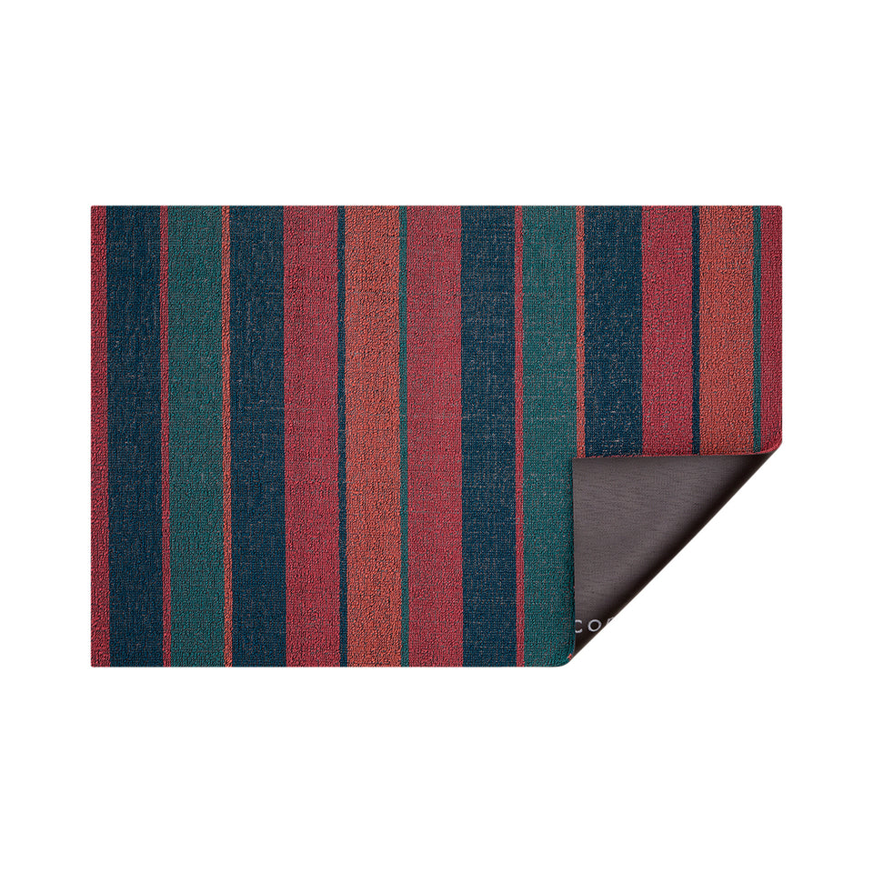 Raspberry Bolt Stripe Shag Mat by Chilewich — folded corner showing the vinyl backing