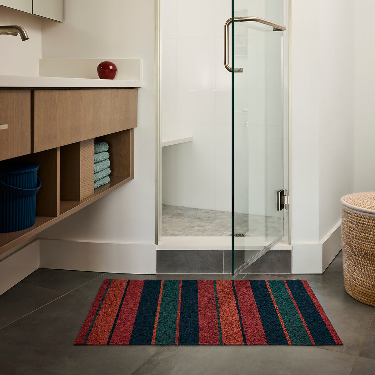 Raspberry Bolt Stripe Shag Mat by Chilewich — in an indoor setting