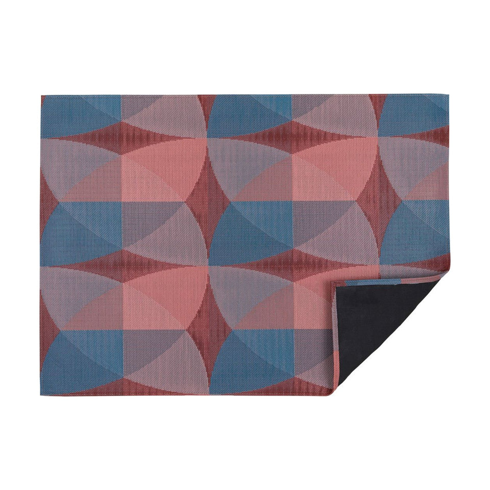 Raspberry Canopy woven floor mat by Chilewich, horizontal folded-corner view