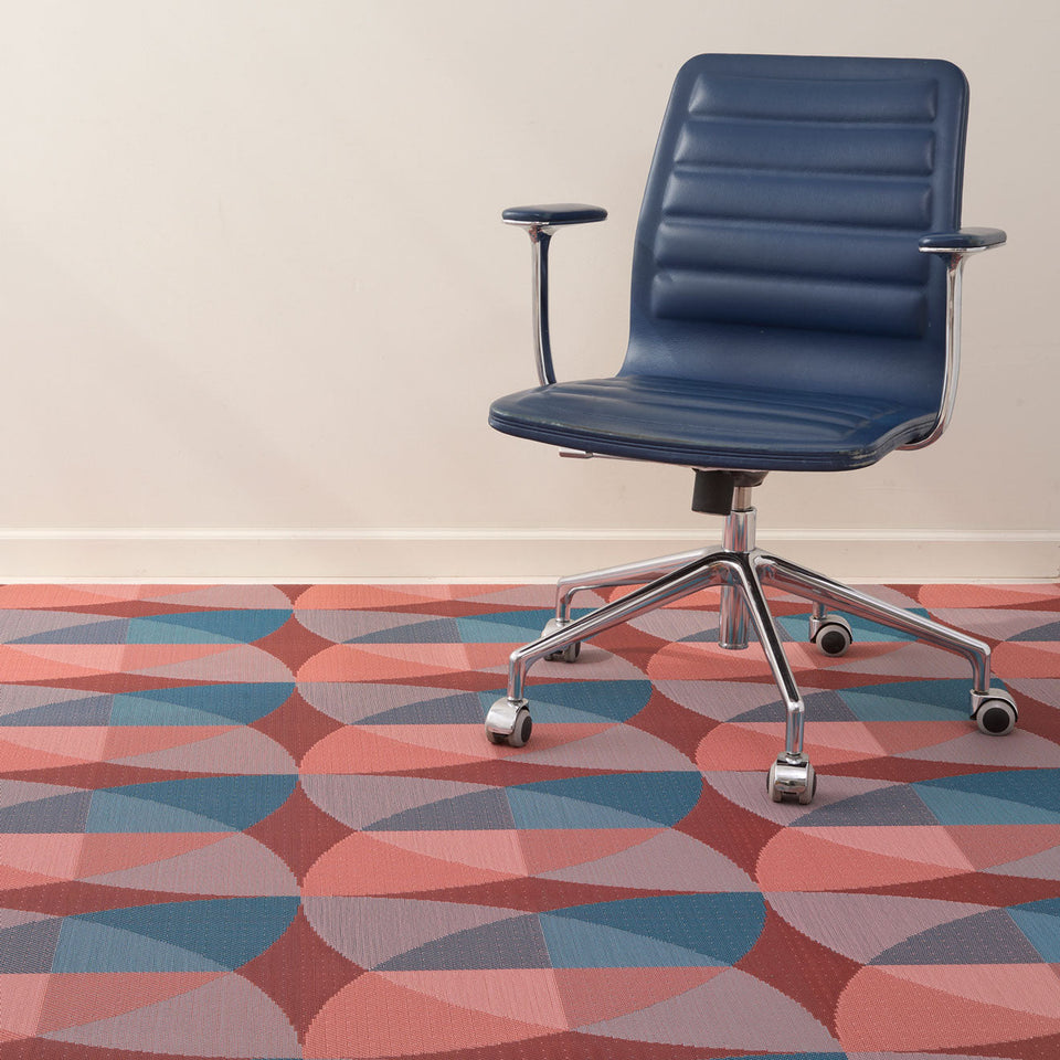 Canopy / Raspberry woven floor mat by Chilewich, interior setting