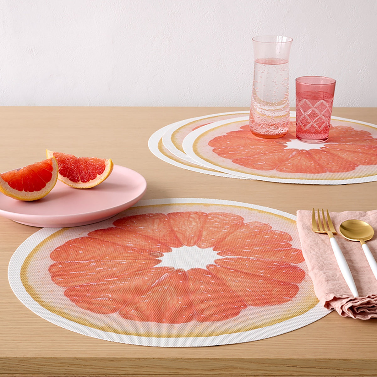 Chilewich Citrus in Grapefruit, shown in a styled table setting
