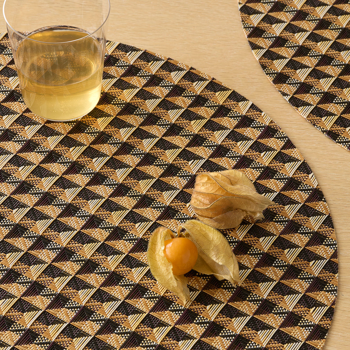 Chilewich Crane in Honey, shown in a styled table setting