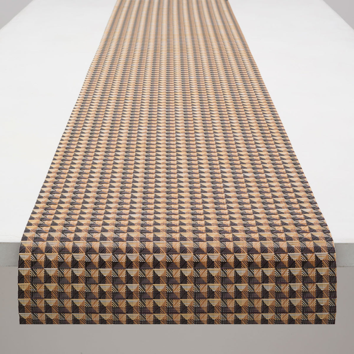 Chilewich Crane runner in Honey, draped along a table
