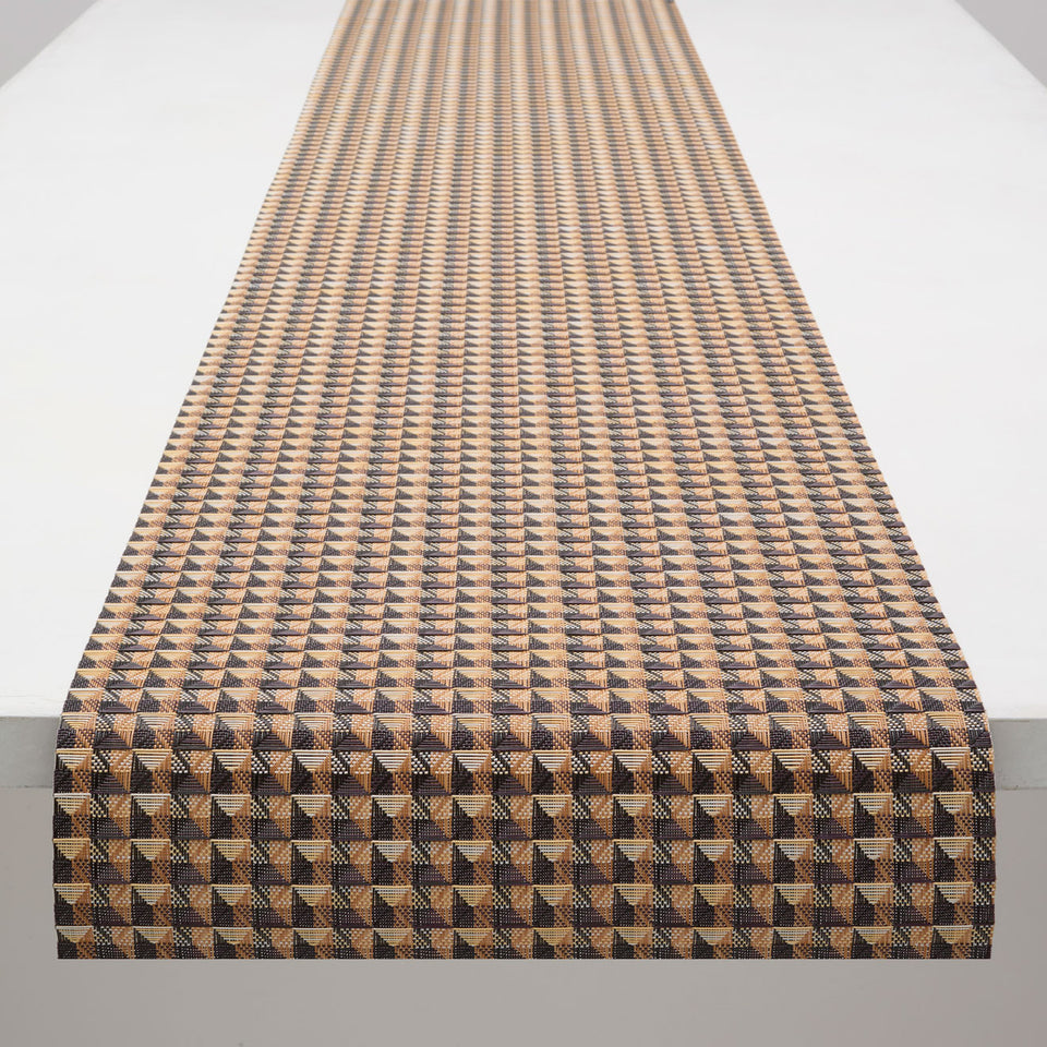 Chilewich Crane runner in Honey, draped along a table