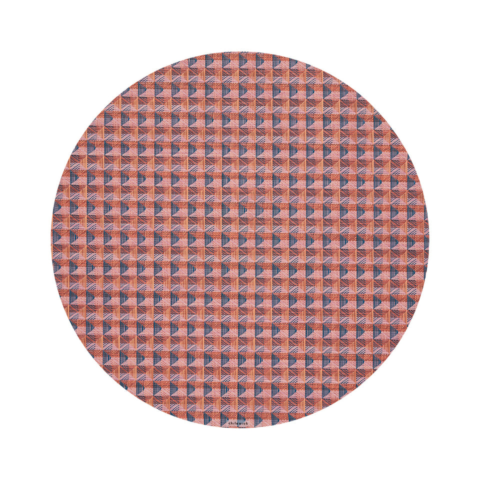Chilewich Crane round placemat in Raspberry, viewed from above on a white background