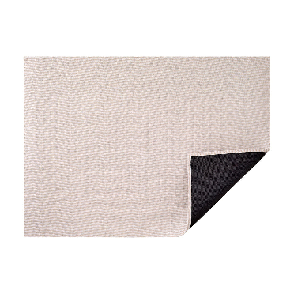 Canvas Dune woven floor mat by Chilewich, horizontal folded-corner view