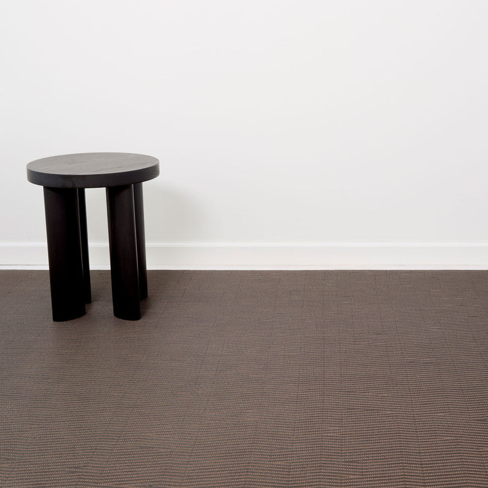 Dune / Raisin woven floor mat by Chilewich, interior setting