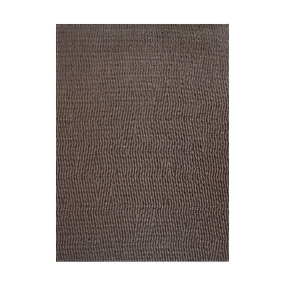 Dune / Raisin woven floor mat by Chilewich, studio view