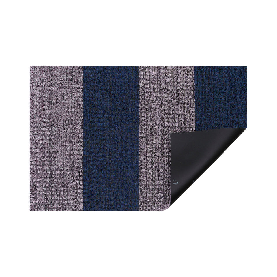 Berry Duo Stripe Shag Mat by Chilewich — folded corner showing the vinyl backing