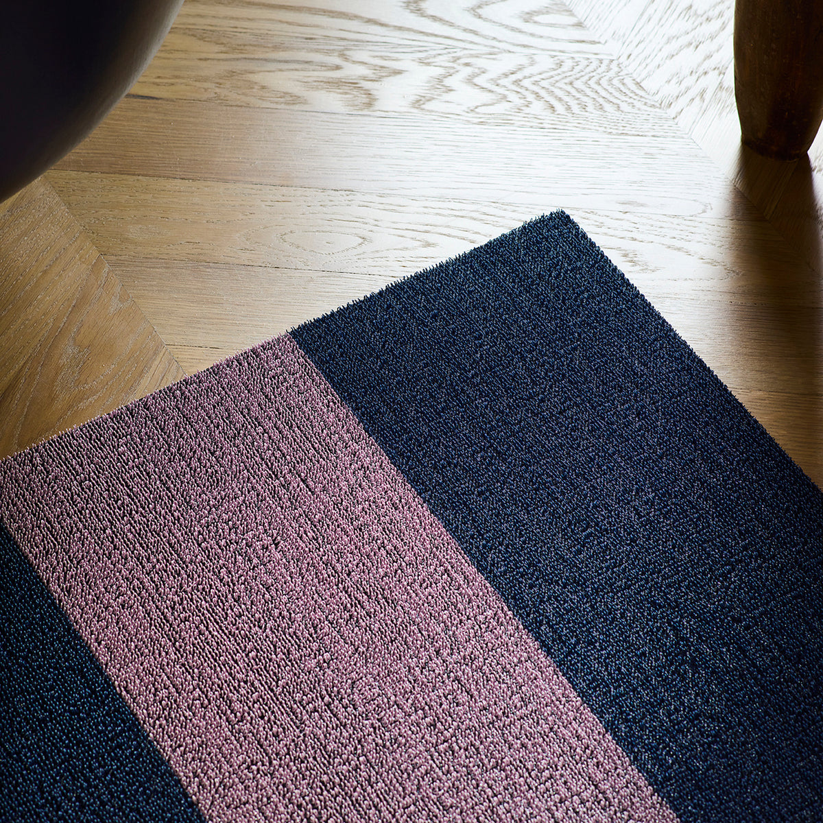 Berry Duo Stripe Shag Mat by Chilewich — in an indoor setting