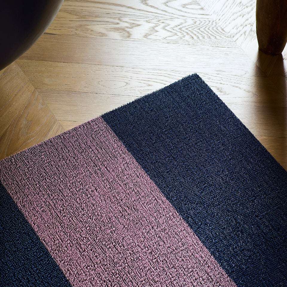 Berry Duo Stripe Shag Mat by Chilewich — in an indoor setting