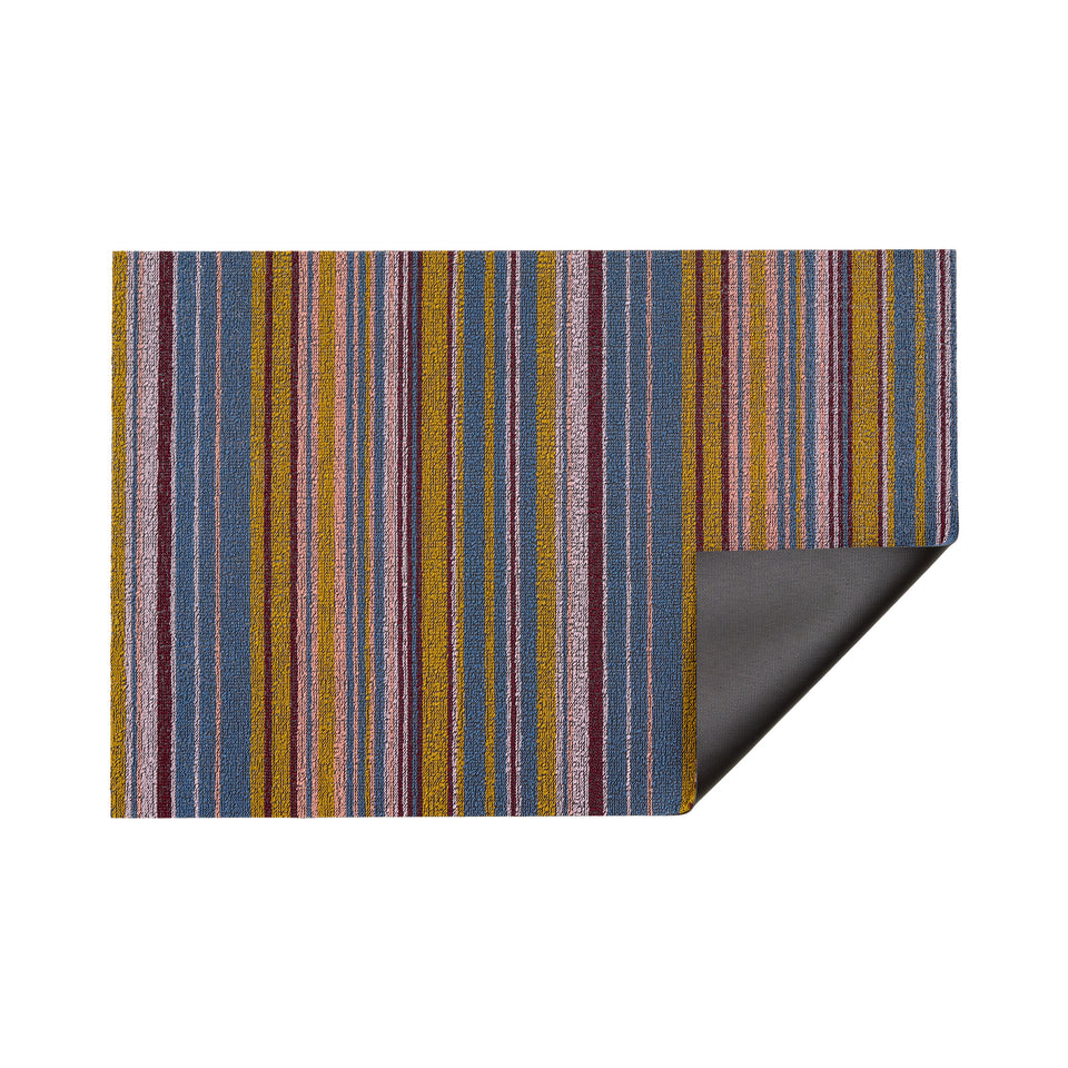Dusk Echo Stripe Shag Mat by Chilewich — folded corner showing the vinyl backing