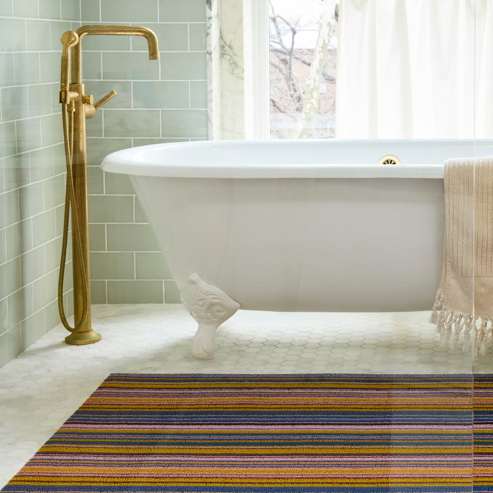 Dusk Echo Stripe Shag Mat by Chilewich — in an indoor setting