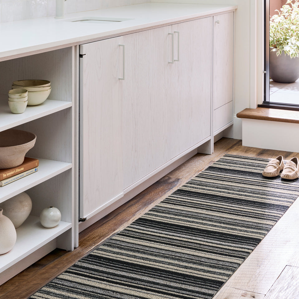 Shadow Echo Stripe Shag Mat by Chilewich — in an indoor setting