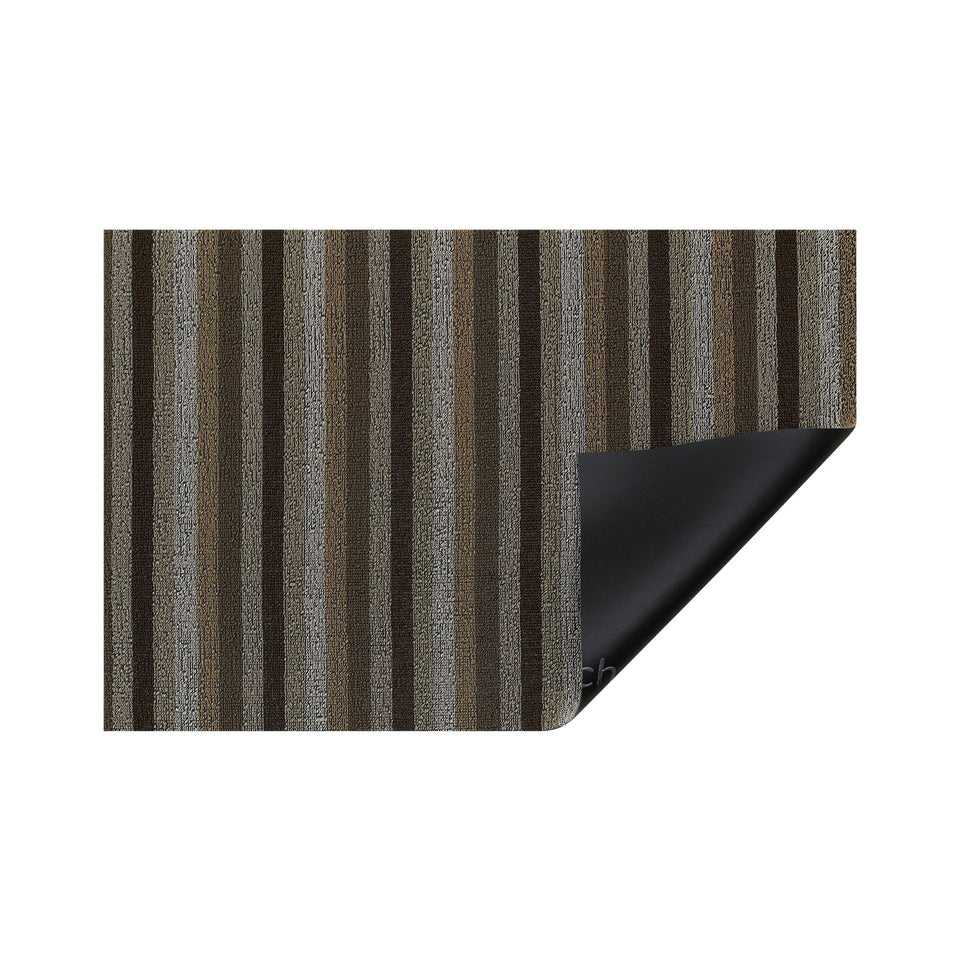 Mocha Even Stripe Shag Mat by Chilewich — folded corner showing the vinyl backing