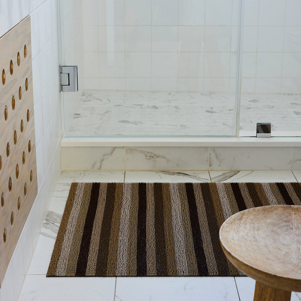 Mocha Even Stripe Shag Mat by Chilewich — in an indoor setting