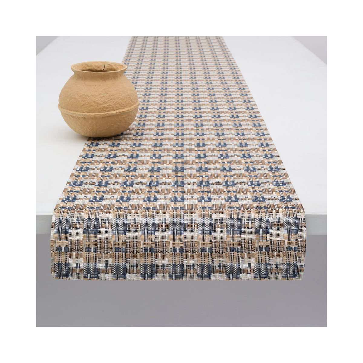 Chilewich Fable table runner in Coast, draped across a table