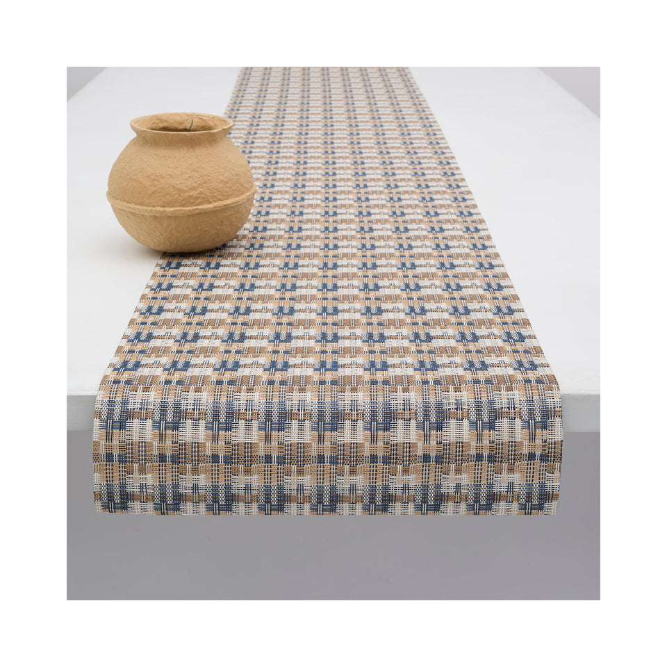 Chilewich Fable table runner in Coast, draped across a table