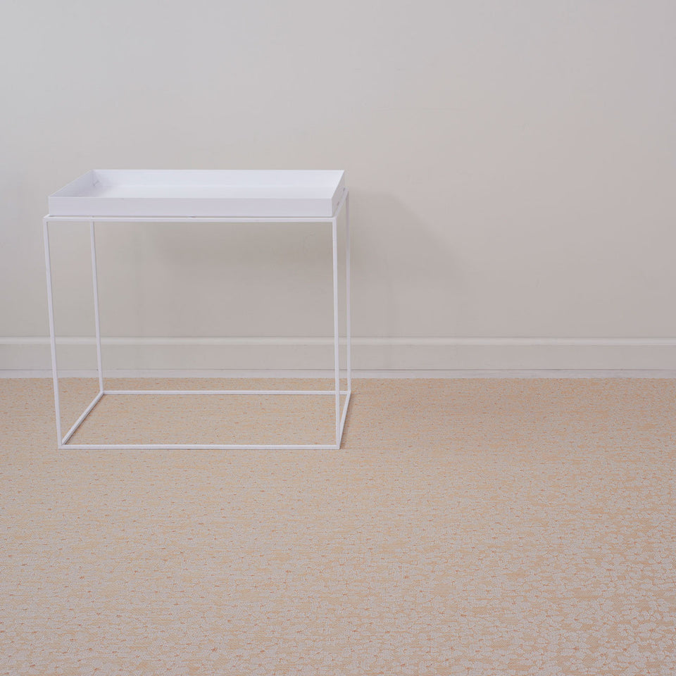 Flora / Almond woven floor mat by Chilewich, interior setting