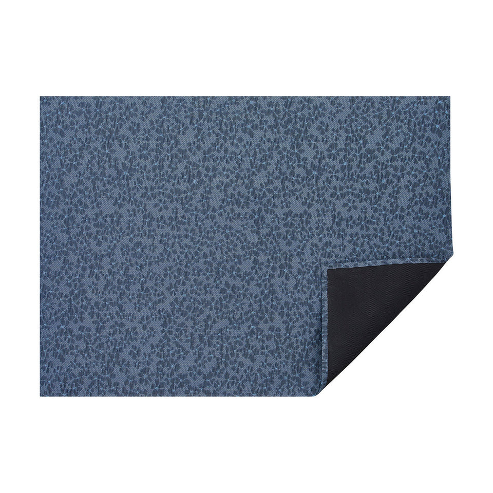 Zephyr Flora woven floor mat by Chilewich, horizontal folded-corner view