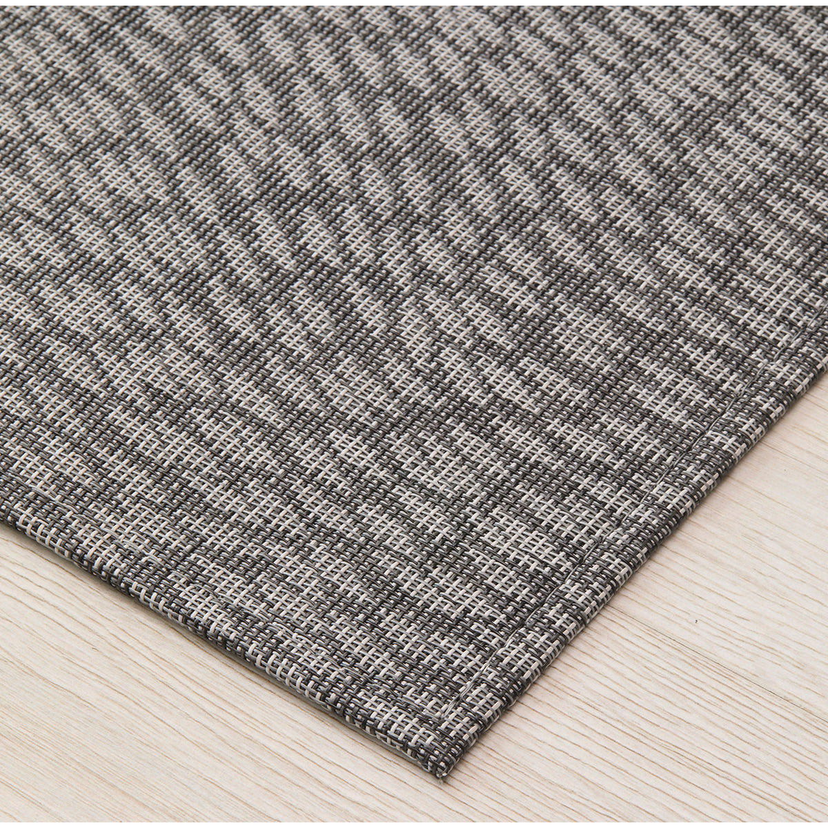 Flutter / Storm woven floor mat by Chilewich, interior setting