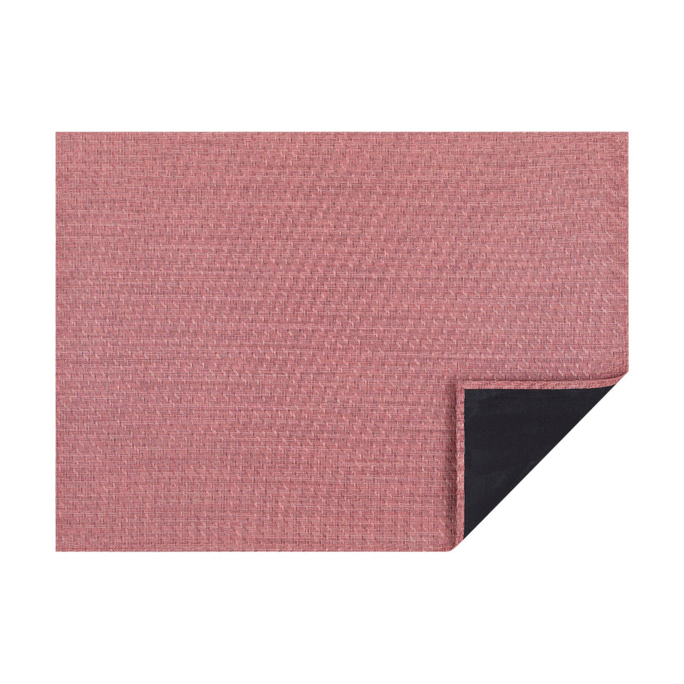 Raspberry Foxtail woven floor mat by Chilewich, horizontal folded-corner view