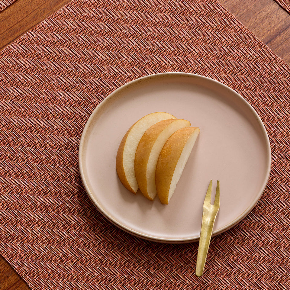Chilewich Foxtail in Raspberry, shown in a styled table setting