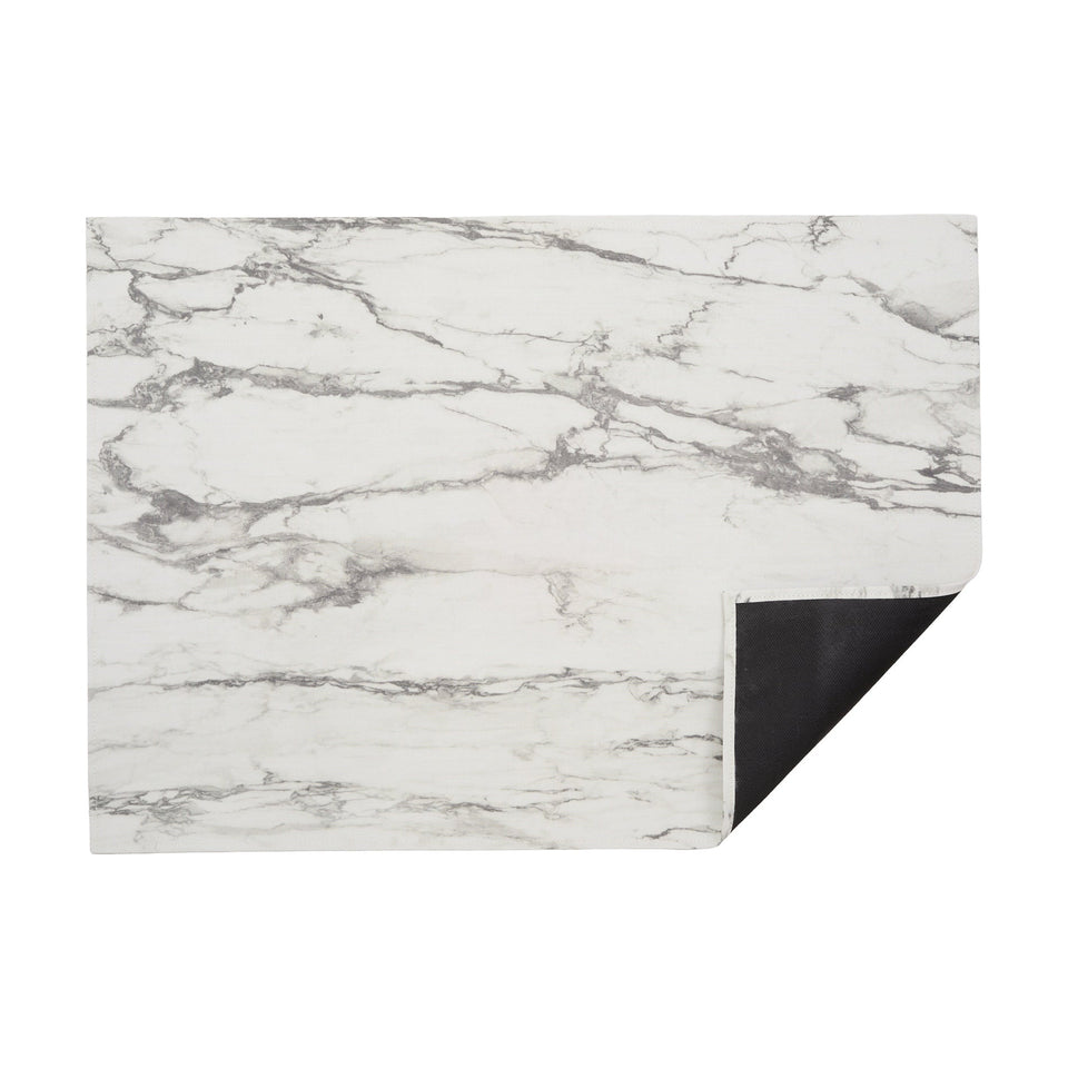 Calacatta Marble woven floor mat by Chilewich, horizontal folded-corner view