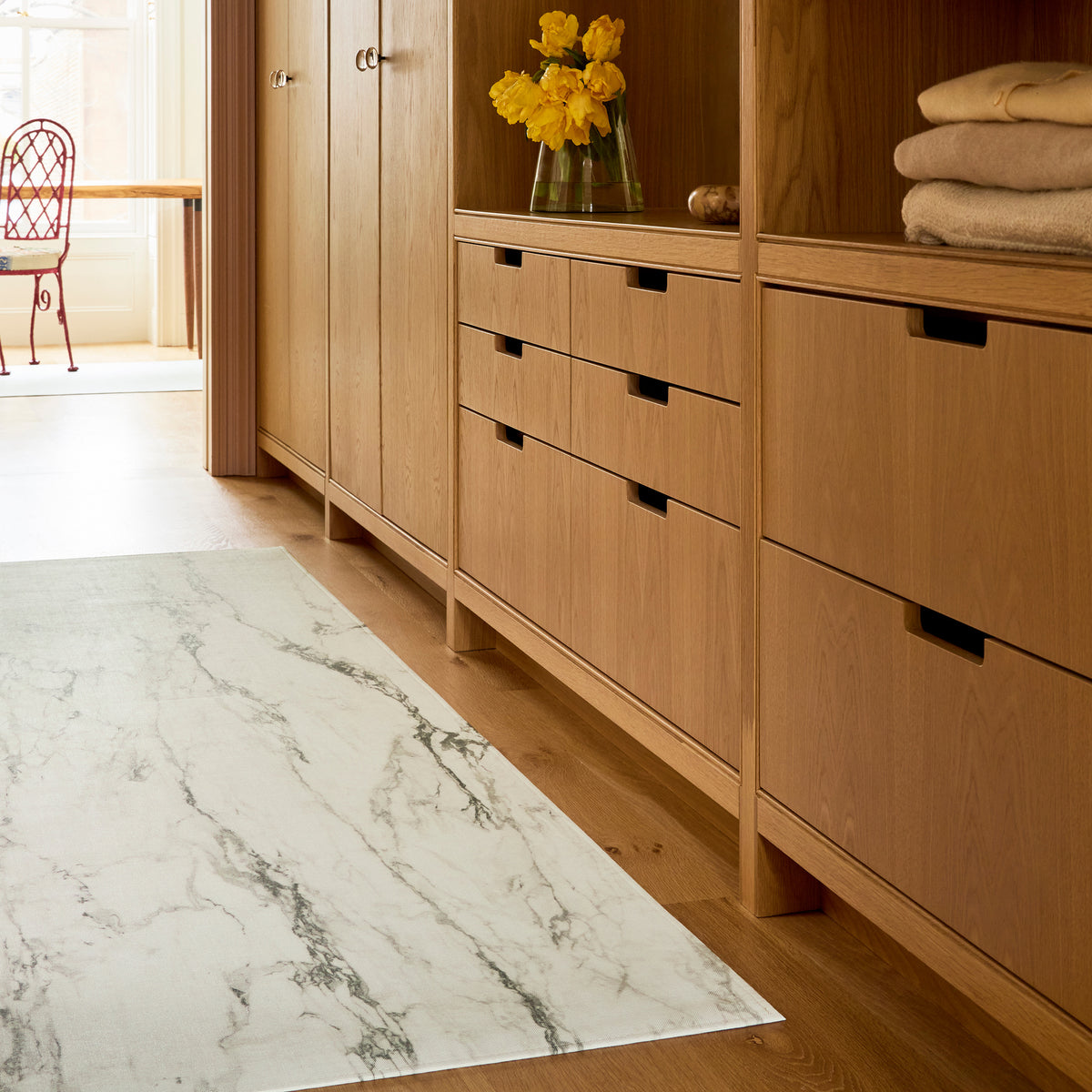 Marble / Calacatta woven floor mat by Chilewich, interior setting